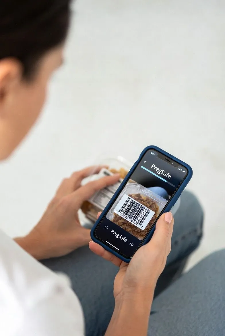 Person checking a product label for pregnancy safety